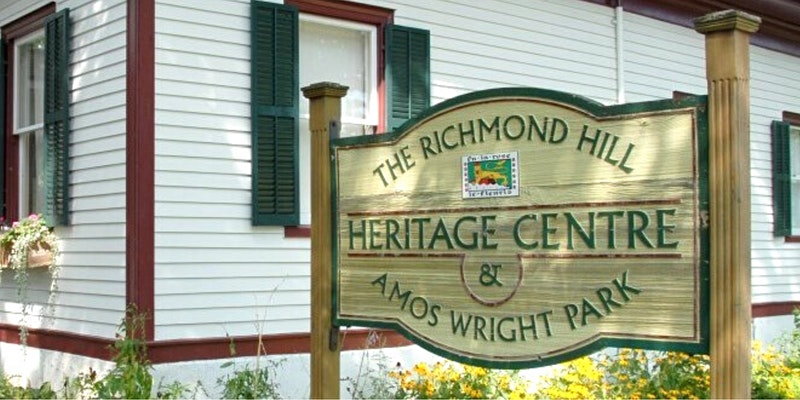 Photograph of the Richmond Hill Heritage Centre and Amos Wright Park sign.