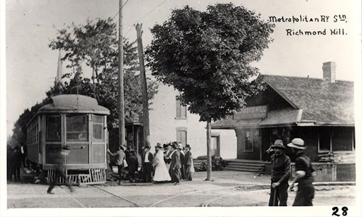 A photograph of passengers boarding car 56 at the Metropolitan Railway Station in Richmond Hill at Yonge Street and Lorne Avenue. - Courtesy of RHPL