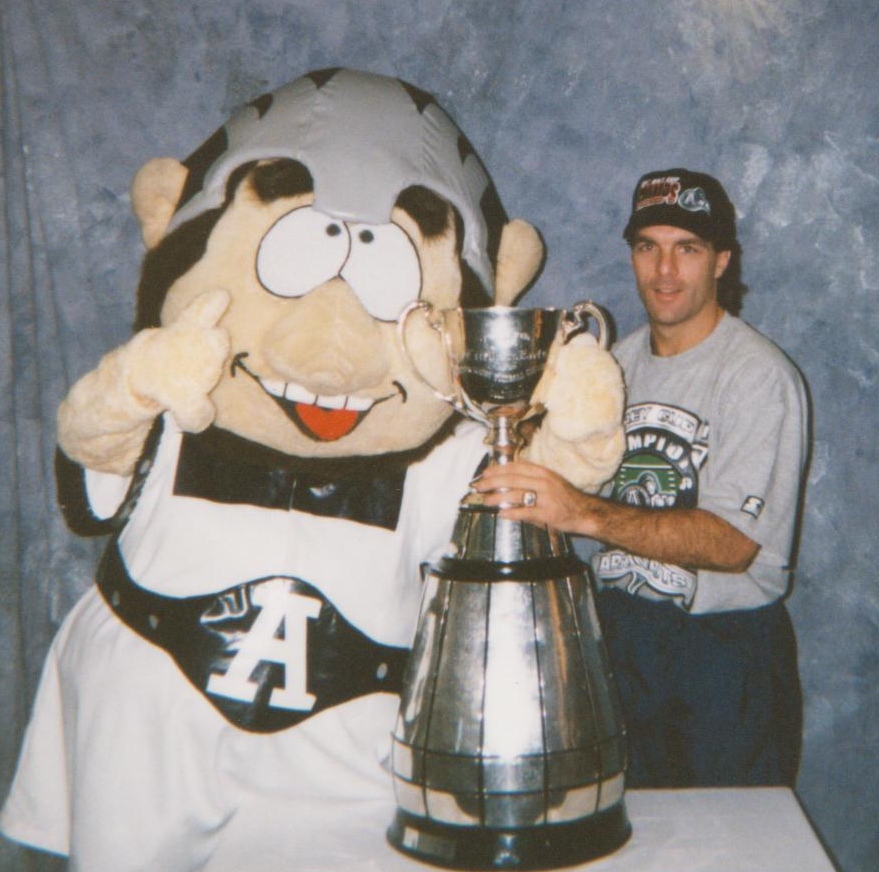 Photograph of Russ Horner as Toronto Argonauts mascot Scully with former Argos quarterback Doug Flutie