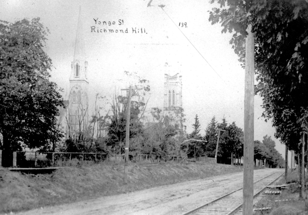 Yonge Street from Major Mackenzie Drive showing St. Mary's Anglican Church and the Richmond Hill Presbyterian Church, ca. 1915. (Photograph courtesy Richmond Hill Public Library, PA91-005)
