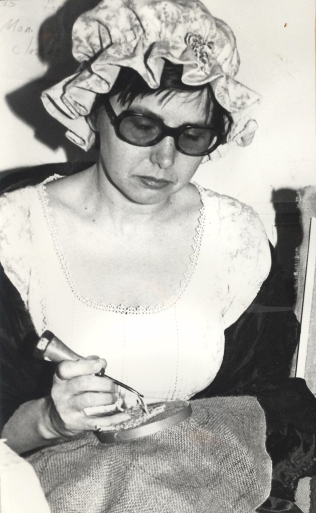 Richmond Hill Historical Society's Janet Fayle demonstrates early needlework at Burr House.