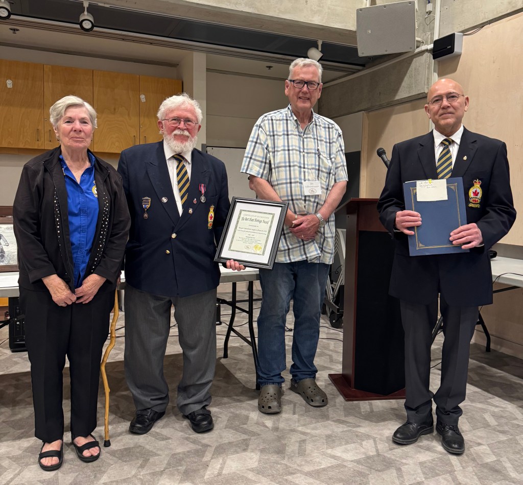 Royal Canadian Legion Branch 375 representatives Sharon Farquharson, Poppy Chair, Ross Toms, Treasurer and Branch Historian, and Bernard de Paulsen, President with Historical Society President Jim Vollmershausen. Jim presented the Bert Hunt Heritage Award to Branch 375 at the Society's June 17, 2025 meeting. (photograph by Peter Wilson)